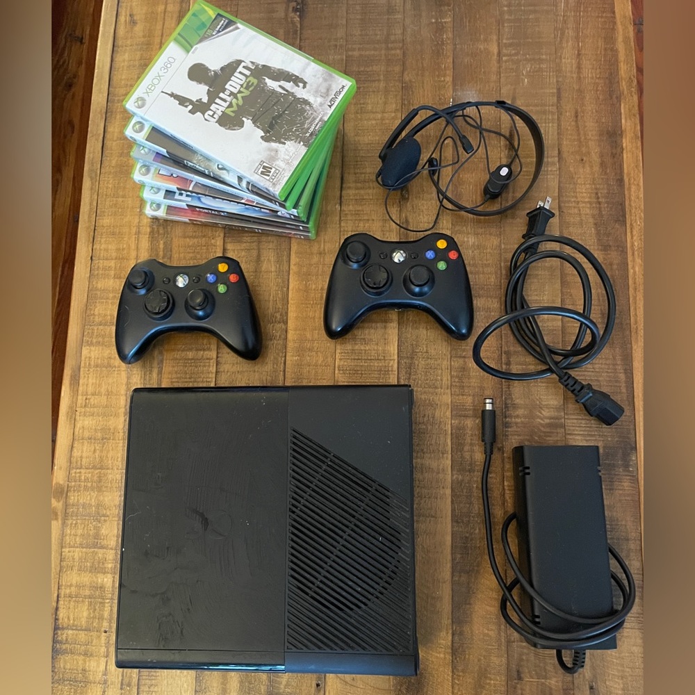 Xbox 360 E Console with 2 controllers and 6 games